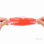 Balle anti-stress rouge, texture agréable et apaisante