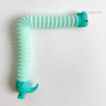 Jouet anti-stress Pop Tube en forme de dinosaure ludique